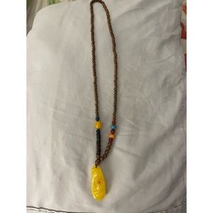 Necklace with floral medallion, used